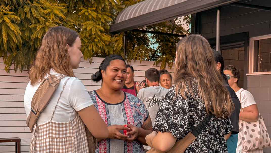 Two men from Majestic Church pose for the camera at a community event.
